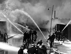 Hosepipes Prints: London firefighters at work with hosepipes