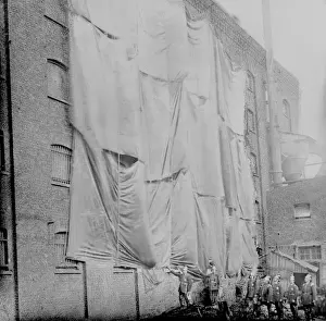London Salvage Corps sheeting a warehouse wall