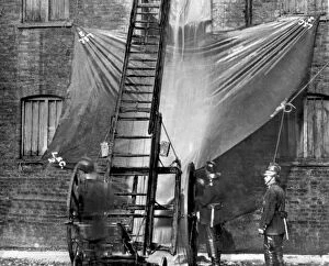 Images Dated 13th October 2011: London Salvage Corps at work with salvage sheets