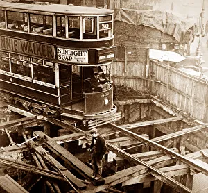 A London tram passing over cut and cover works