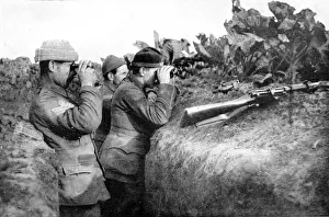 Enemys Prints: Looking for the daring German sniper: British soldiers engaged in locating one of the enemys sharpshooters