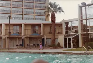 Lorna Holder walking by the swimming pool