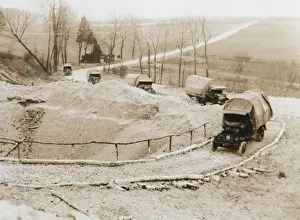 Makeshift Prints: Lorries passing mine crater on way to Western Front, WW1