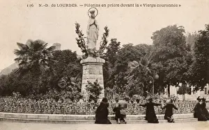Lourdes, France - Praying before the Virgin Crowned statue