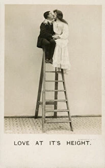 Images Dated 4th April 2019: Love at its Height - a couple embrace at top of stepladder
