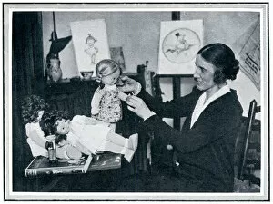 Mabel Lucie Attwell designing dolls