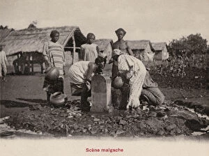 Madagascan Collection: Madagascan women gathering water from a fountain