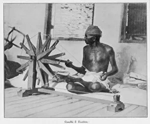 Leader Collection: Mahatma Gandhi spinning at his wheel