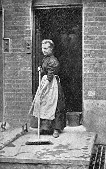 Brushing Prints: A maid-of-all-work sweeps a step, c. 1900