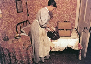 Images Dated 26th April 2012: Maid Packs her Bags