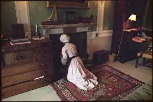 Maid Tends to Fire