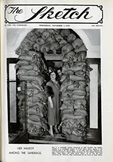 Sandbags Prints: Her Majesty, the Queen amongst sandbags