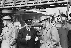 Major Jackson, Chief of the London Fire Brigade, explaining a print to Battalion Chief