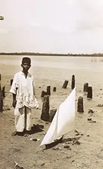 Malaysian Prints: A Malaysian boy with a toy yacht