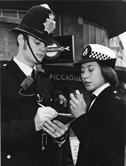 Male and female police officers on duty in London