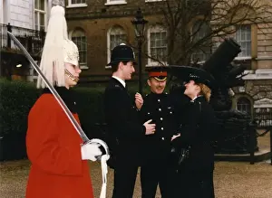 Male and female police officers in a London street