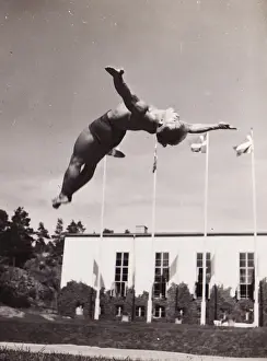 Male gymnast backward leap