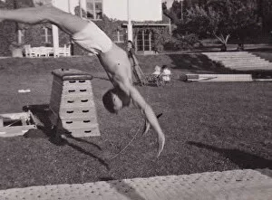 Gymnast Gallery: Male gymnast backward leap