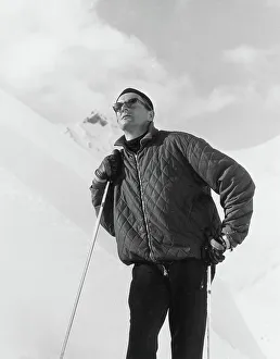 Quilted Prints: A male skier wearing a quilted jacket poses on the slopes. Date: late 1960s