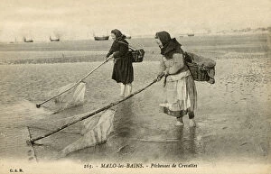 Malo-les-Bains, France - women fishing for shrimp