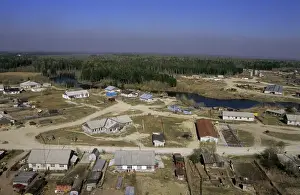 Taiga Prints: Maloyuganskii village - aerial of village and taiga forest