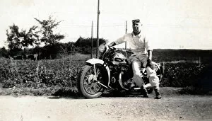 Man on his 1937 Ariel Square Four motorcycle