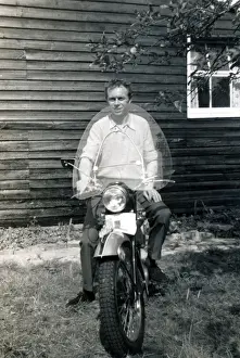 Man on 1950s Triumph motorcycle