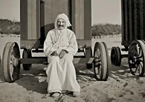 Man in bath robe outside bathing hut