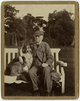 Man on a bench with his sheepdog