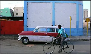 Man on bike, street, Havana, Cuba