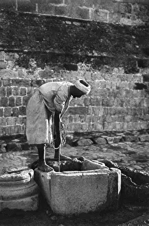Cistern Prints: Man at a cistern near Church of Nativity, Bethlehem