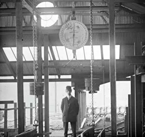Man under coal weighing machine, Llanerch Colliery