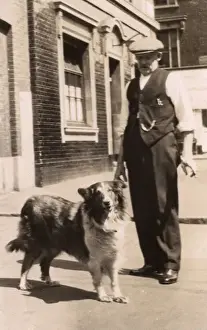 Shirtsleeves Prints: Man with a collie dog in a street