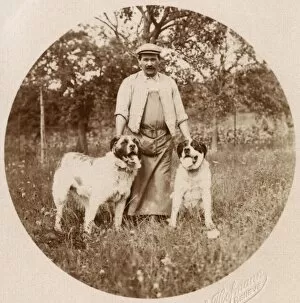 Man with two dogs in a field, Switzerland