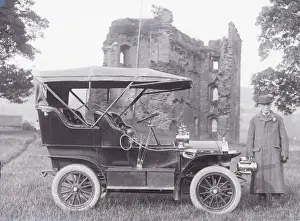 Man with early car, Crickhowell Castle, Powys, Mid Wales