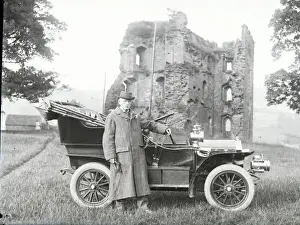 Man with early car, Crickhowell Castle, Powys, Mid Wales