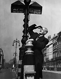 Cleansing Prints: Man examining street signs