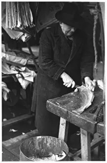 Over Coat Gallery: A Man Filleting Fish