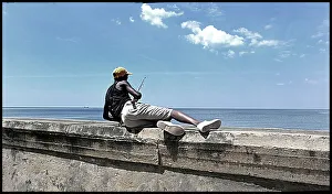 2009 Prints: Man fishing of harbour wall, Havana, Cuba