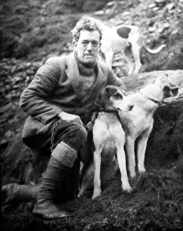 man with foxhounds