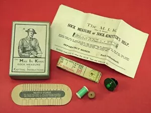 Images Dated 30th October 2013: Man in Khaki WW1 sock knitting kit box and instructions