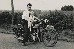 Triumph Gallery: Man and little boy on 1933 Triumph motorcycle