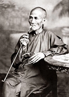 New Images May Collection: Man with long fingernails and pipe circa hina, circa 1880s. Date: circa 1880s