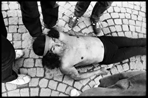 Nails Prints: Man lying on bed of nails - street performer, Paris, France