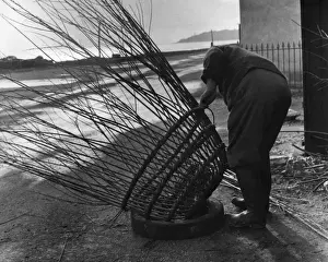Man making lobster pot at Beesands, Start Bay, Devon