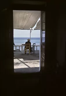 Man in Mediterranean cafe, Thassos