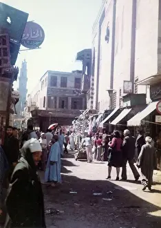Man nearest the camera in long black traditional Egyptian dr