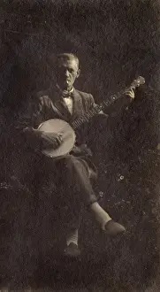 Crossed Prints: Man playing the banjo