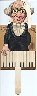 Images Dated 16th May 2018: Man playing the piano on a cutout Christmas card