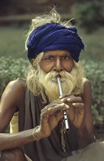 Agra Gallery: Man playing tin whistle, Agra, India - 1